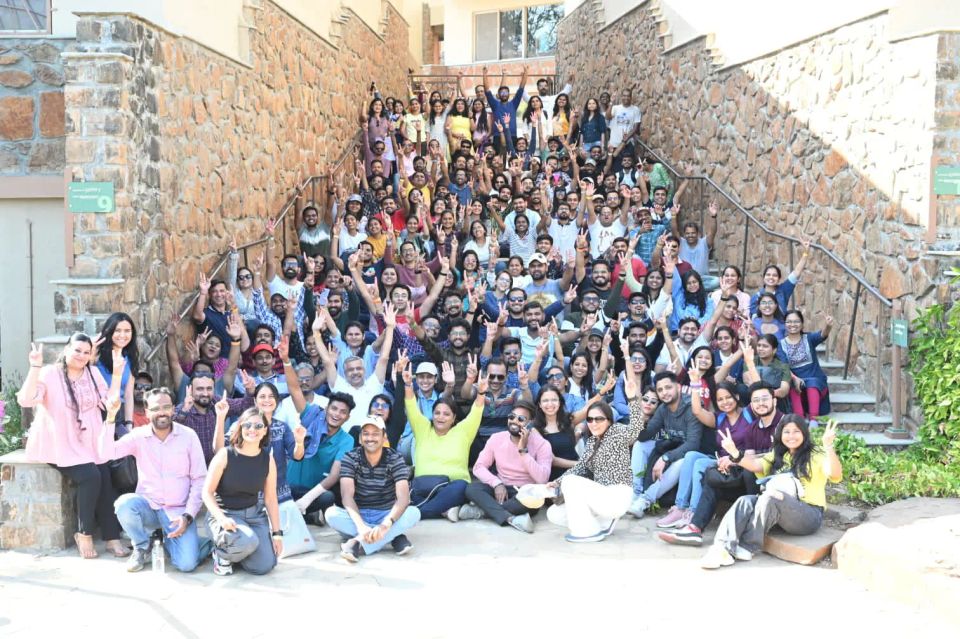 Large corporate team group photograph on stone stairs at an outdoor IBM offsite at Zapurza