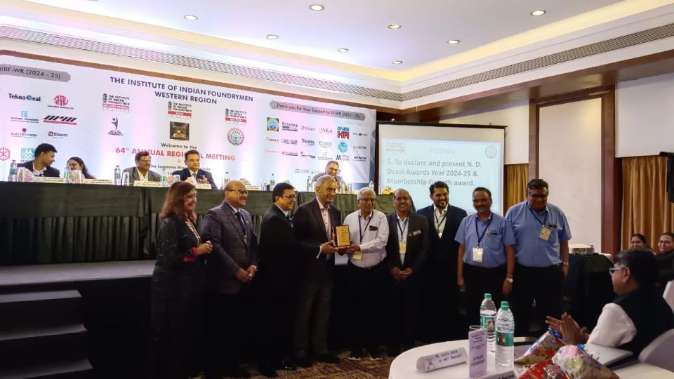 Award presentation on stage at the Institute of Indian Foundrymen Western Region annual regional meeting