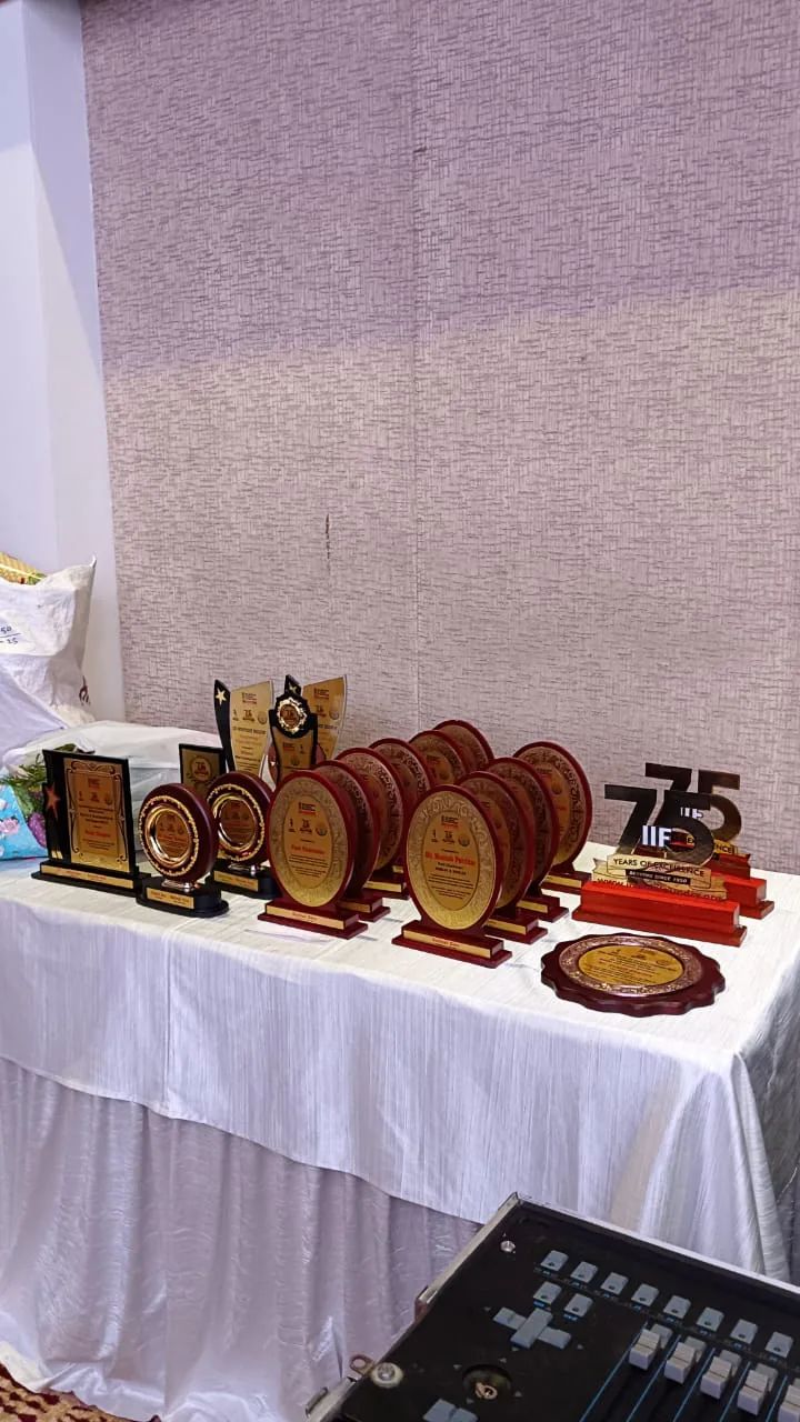 Trophies and recognition plaques prepared for a corporate awards ceremony