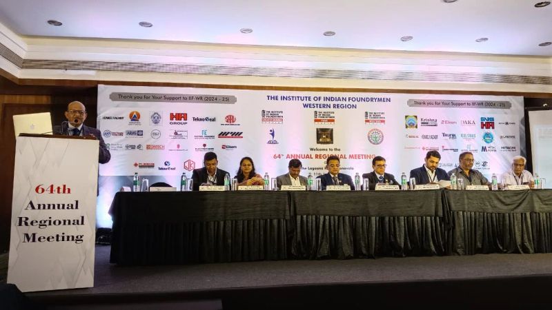 MICE conference stage with head table, branded backdrop and podium for an industry annual meeting